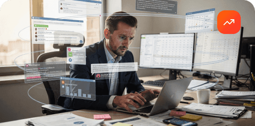 A man intensely focused on his laptop screen with code and graphs overlaid.